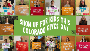 People holding show up for kids signs